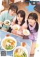 A group of young women sitting at a table eating food.